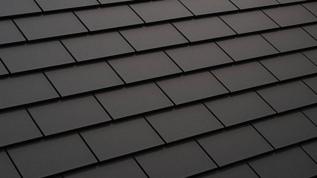 Obrazek przedstawia czarną dachówkę płaską na dachu